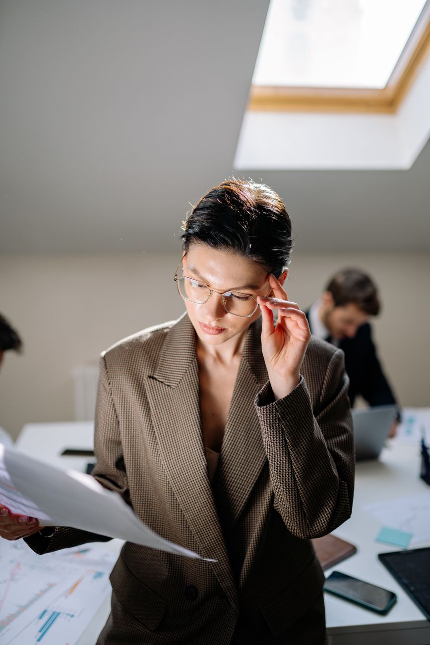Principal reviewing a document in the office